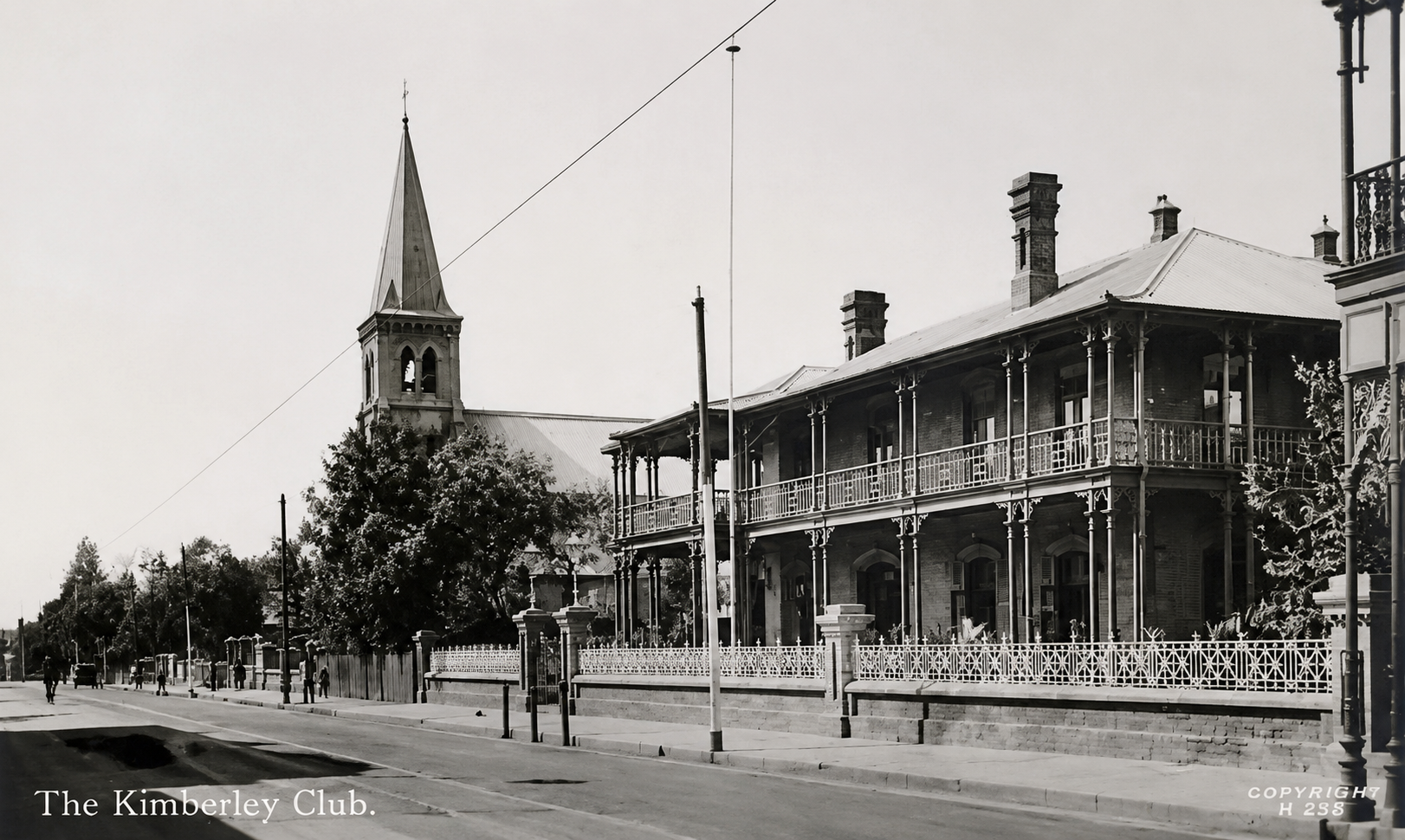 The Kimberley Club and St Mary’s Catholic Church on Du Toitspan Road, showing the later stone bell tower and the expanded Club frontage.