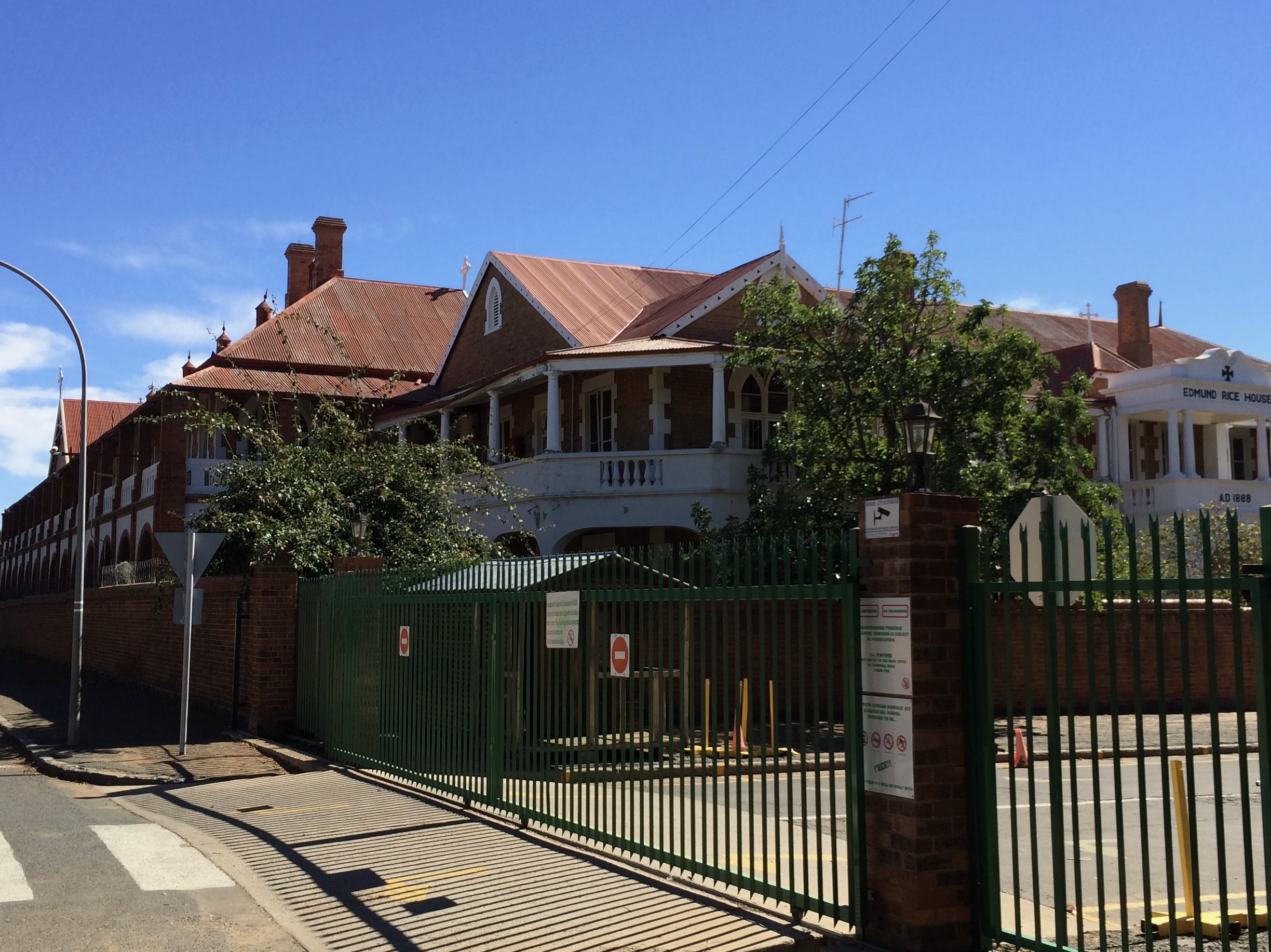 Undamaged Oppenheimer House, formerly Nazareth House, showing its brick walls, arches and long collonaded structure.