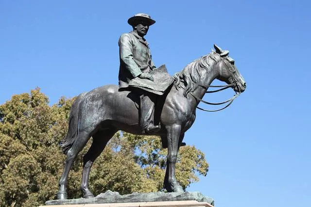 Bronze equestrian statue of Cecil Rhodes in Kimberley showing Rhodes seated on horseback and holding a map of Africa.