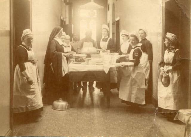 Historic photograph showing nurses and nursing sisters working inside Kimberley Hospital.
