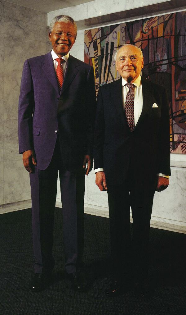 Nelson Mandela and Harry Oppenheimer standing together during a meeting in Johannesburg in 1999.
