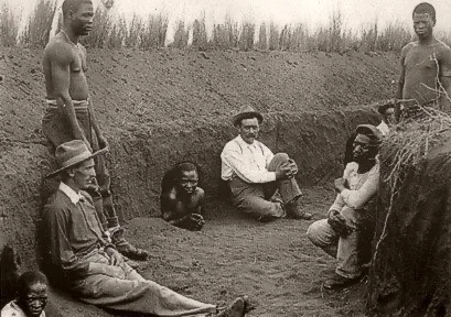 Waiting in a redoubt. 
In warfare, a redoubt is an isolated, fortified emplacement. It is typically built rapidly using earthworks, stone, or timber to defend a specific location.