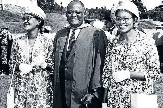 Professor Z.K. Matthews standing with his daughters during a University of Fort Hare graduation ceremony in 1961.