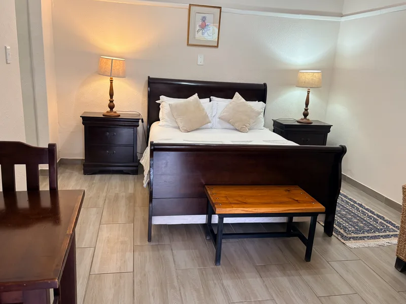 Room 6 queen size bed at the Solomon Edwardian Guest House