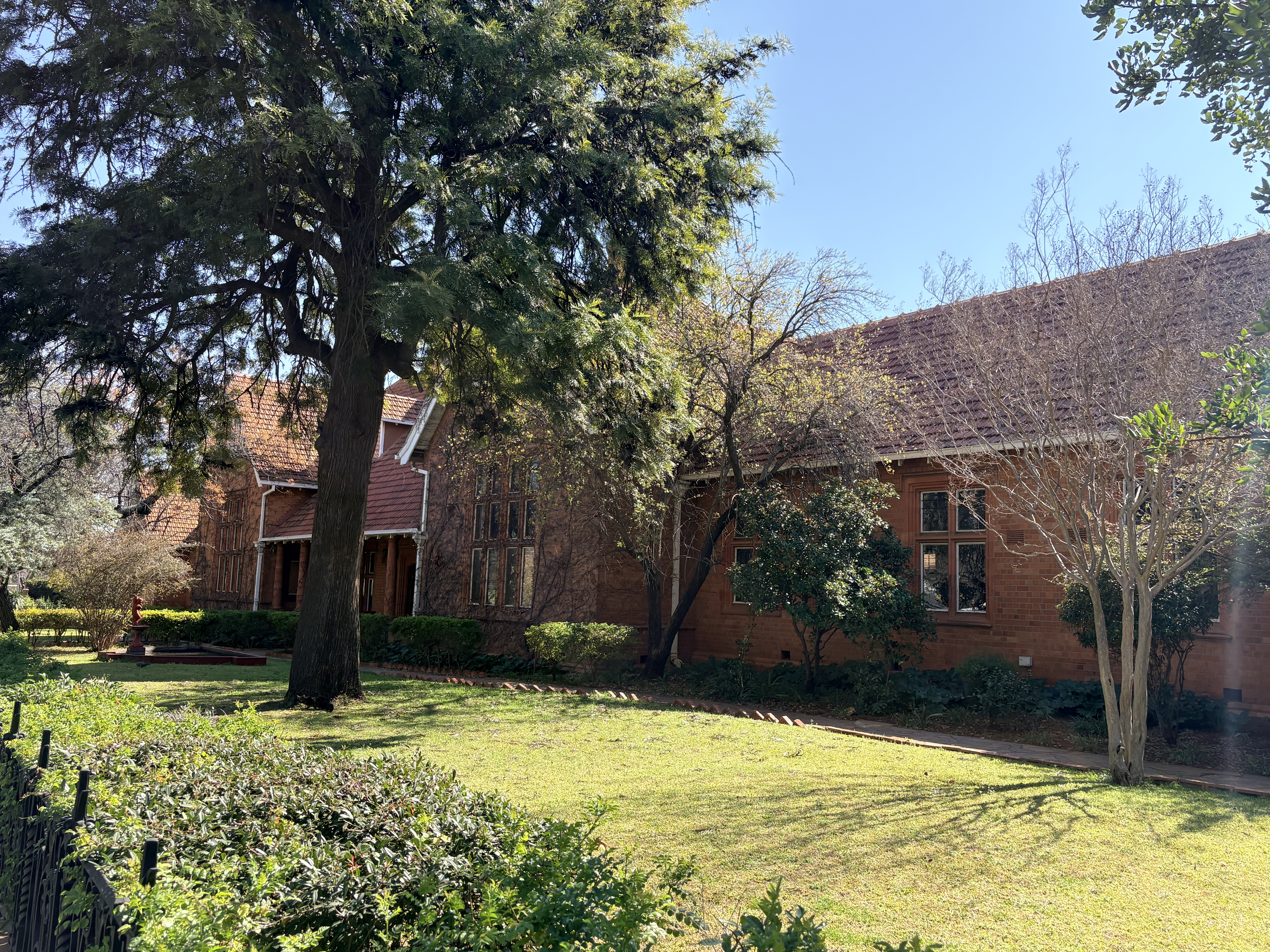 Kimberley Girls' High School is as much a garden campus as it is an architectural landmark. More than a century of carefully tended trees and lawns has transformed the school into one of Kimberley's most picturesque heritage sites.