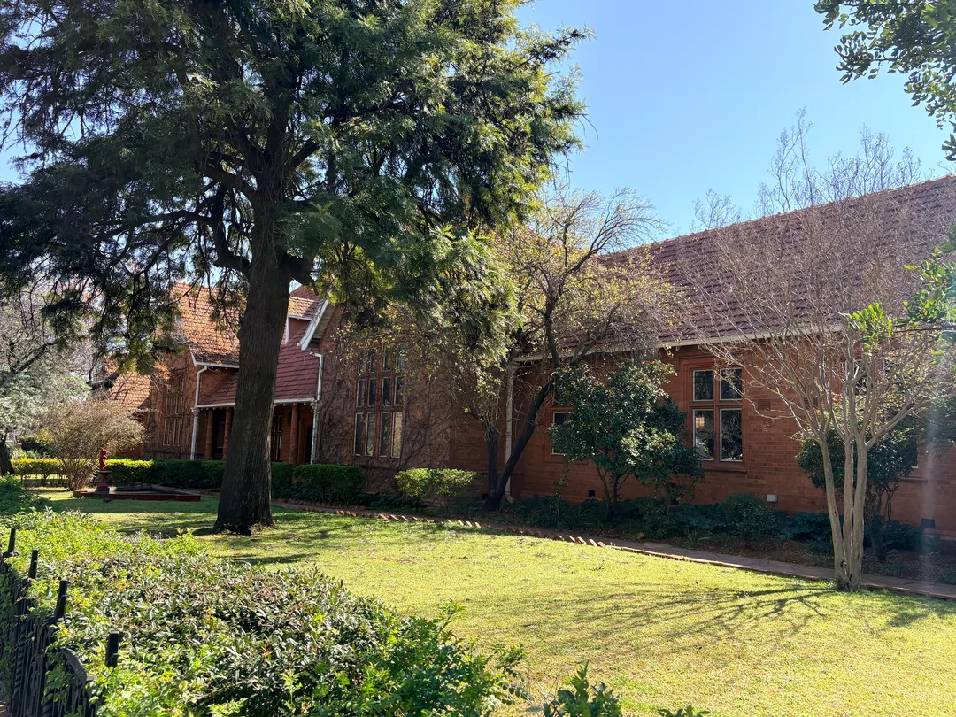 Kimberley Girls' High School is as much a garden campus as it is an architectural landmark. More than a century of carefully tended trees and lawns has transformed the school into one of Kimberley's most picturesque heritage sites.