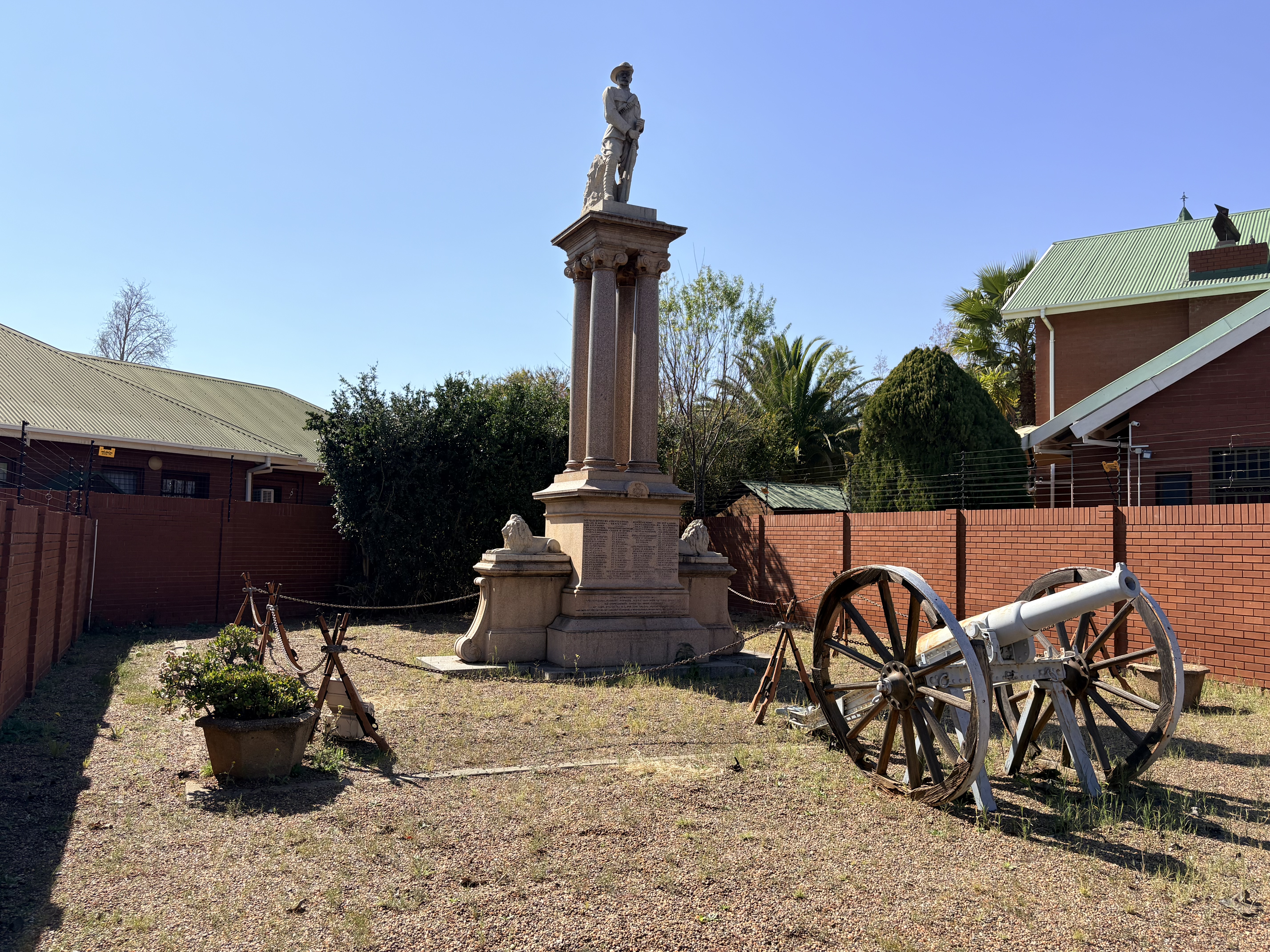 The Cape Police Memorial in its Belgravia setting. Unveiled in 1904, the granite monument faces Carter's Ridge, where several Cape Police officers lost their lives during the Siege of Kimberley.
