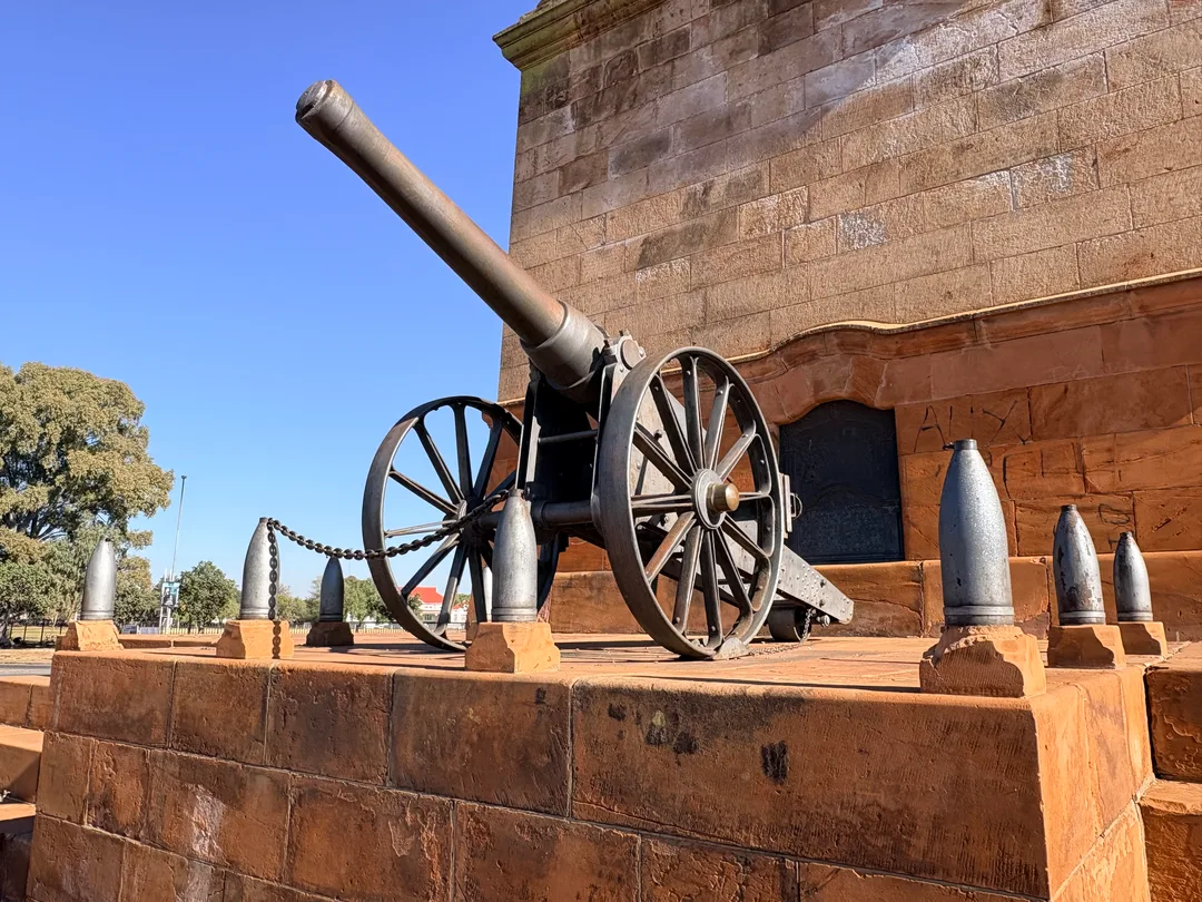 Eastern view of the Honoured Dead Memorial in Kimberley with Long Cecil displayed prominently on the sandstone stylobate below Sir Herbert Baker's classical memorial.