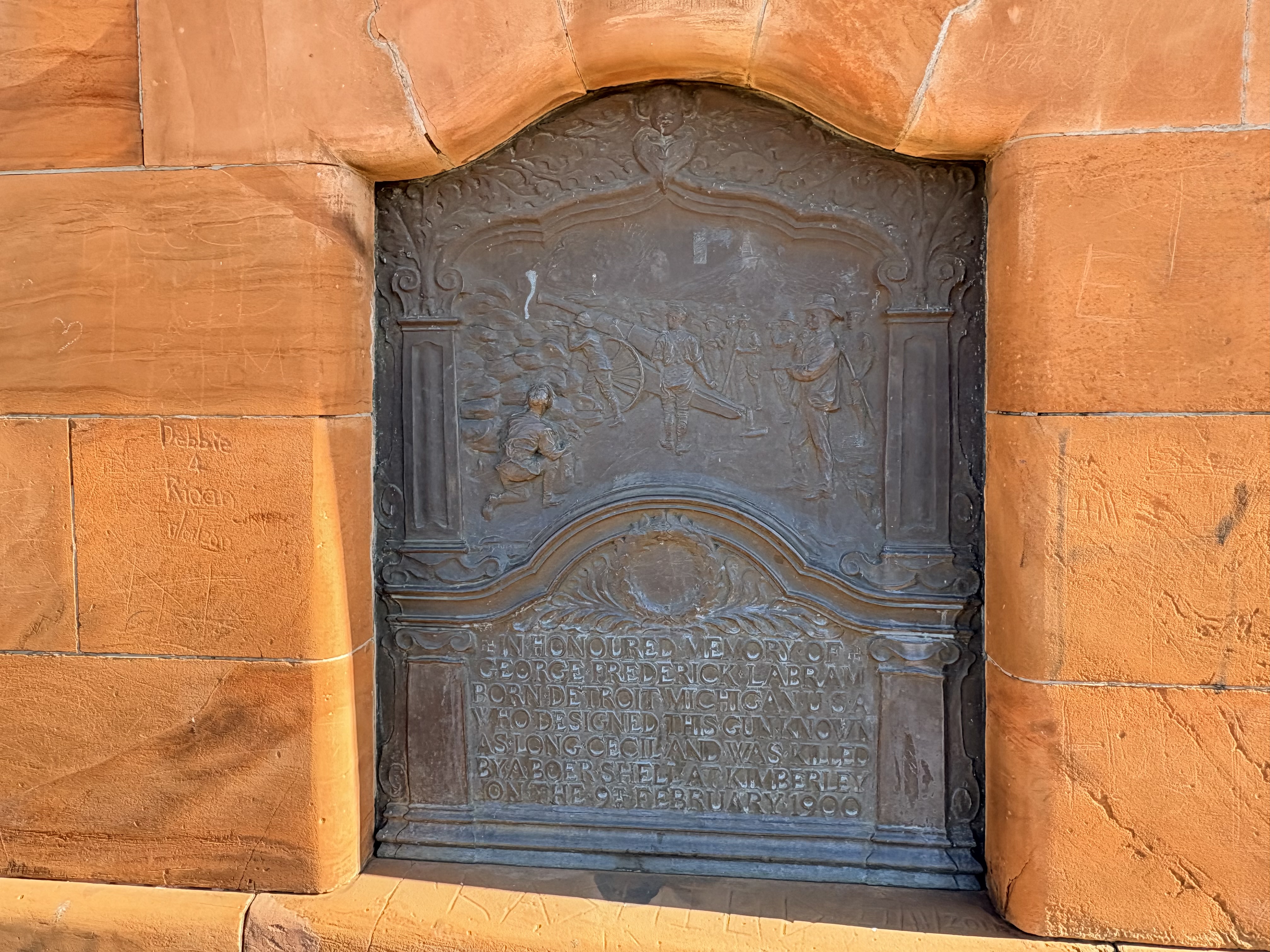 Bronze memorial plaque honouring George Frederick Labram, chief designer of Long Cecil, located behind the gun at the Honoured Dead Memorial in Kimberley. The plaque was designed by John Lockwood Kipling, Rudyard Kipling's father.
