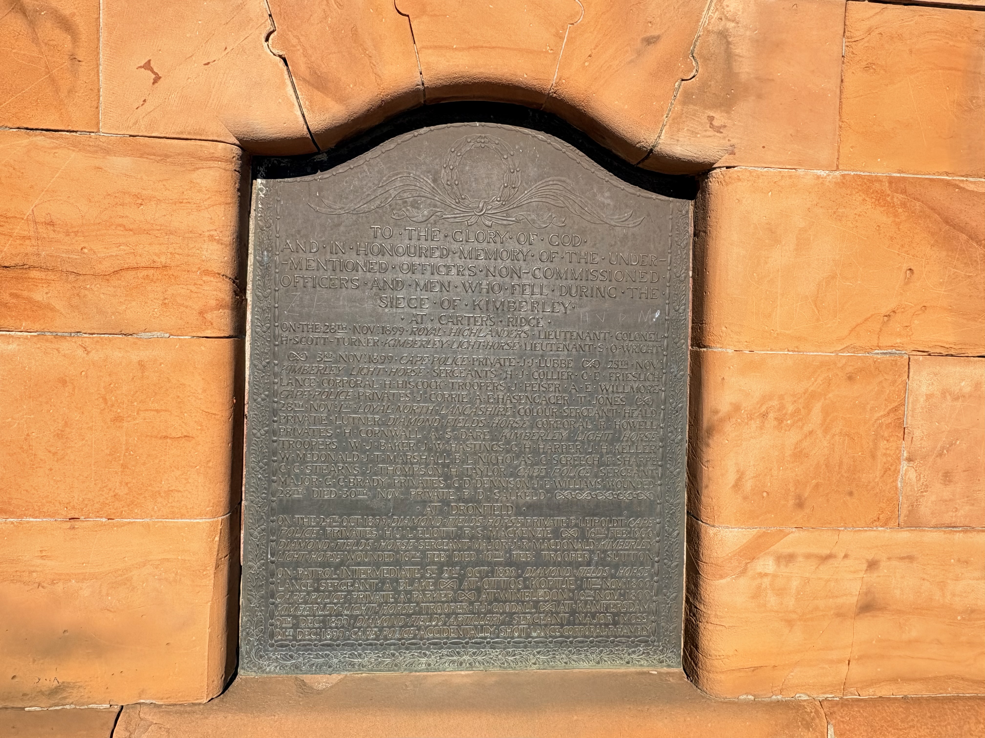 Bronze memorial plaque recording the names of officers and men who died defending Kimberley during the Siege of Kimberley. The plaque was designed by John Lockwood Kipling, Rudyard Kipling's father.