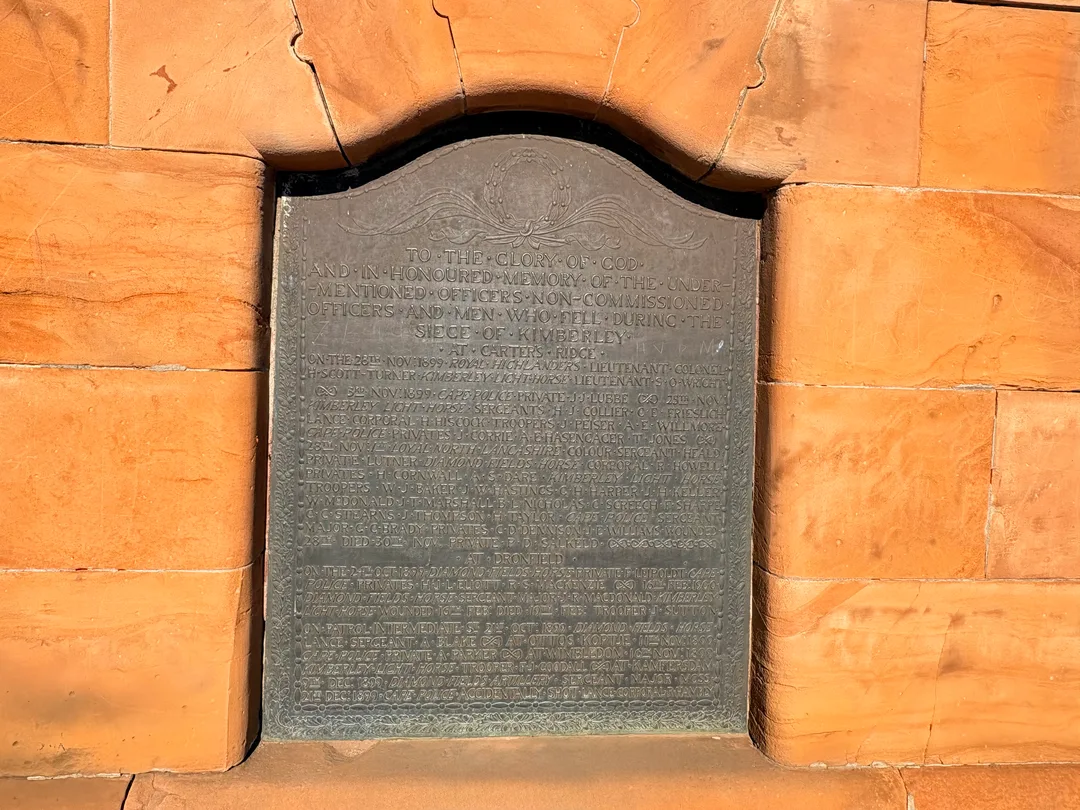 Bronze memorial plaque recording the names of officers and men who died defending Kimberley during the Siege of Kimberley. The plaque was designed by John Lockwood Kipling, Rudyard Kipling's father.