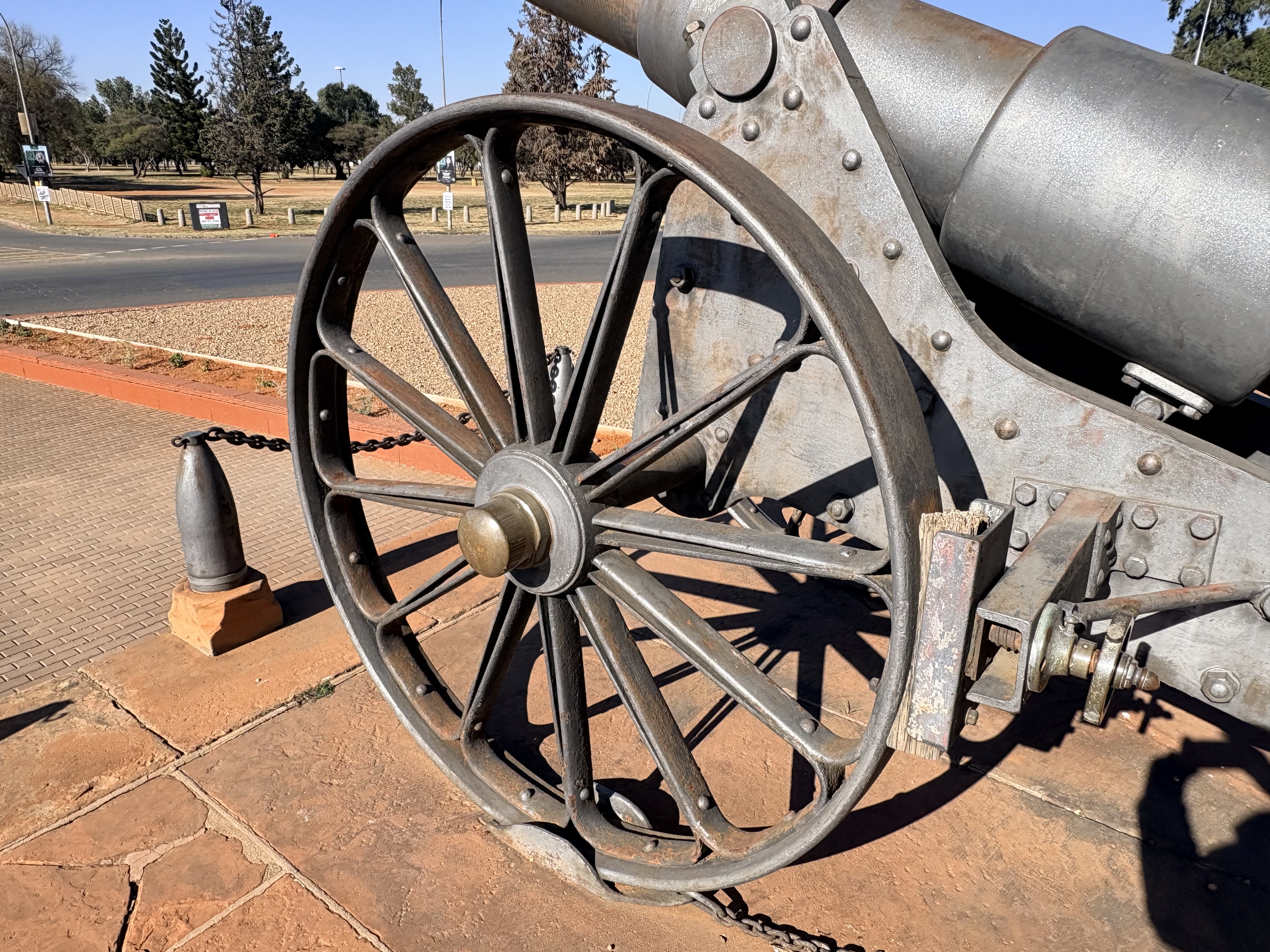 Detailed view of Long Cecil's steel-spoked wheel and gun carriage, showcasing the craftsmanship achieved by the De Beers engineers during the Siege of Kimberley.