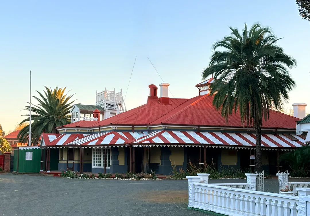Rudd House heritage home in Belgravia, Kimberley, viewed across its grounds.