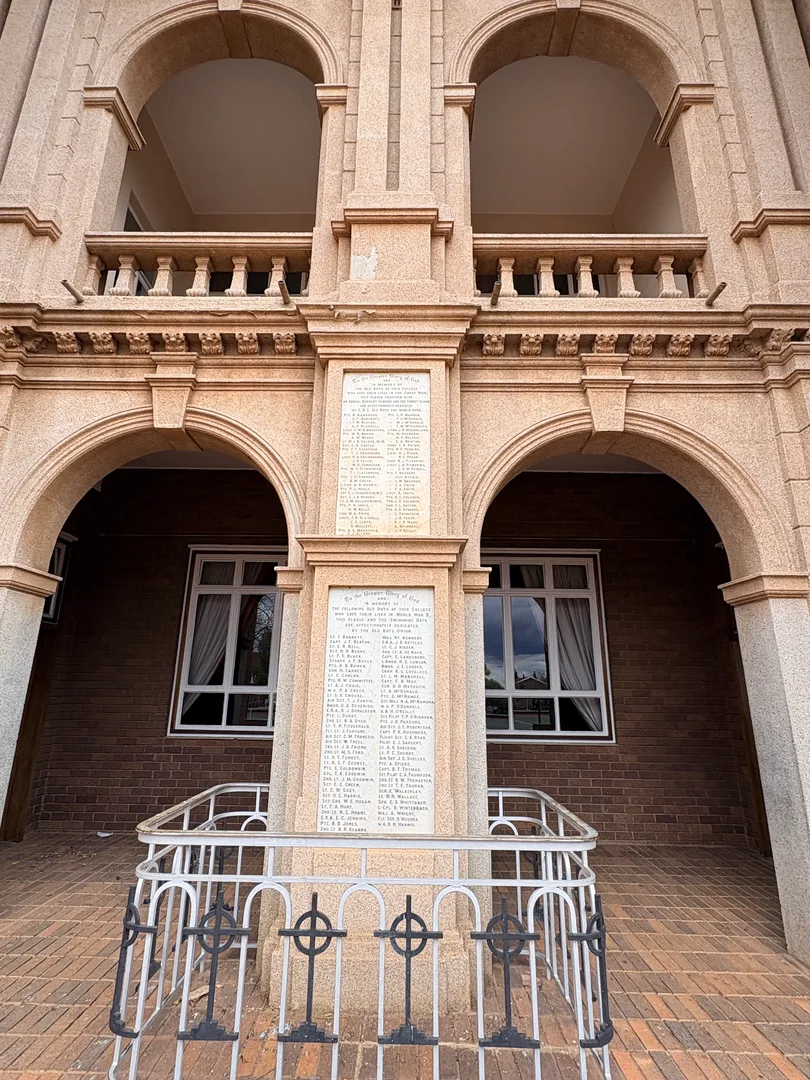 The Cenotaph on the long front facade of St Patrick's CBC displays memorial plaques listing former pupils who died in wartime service.