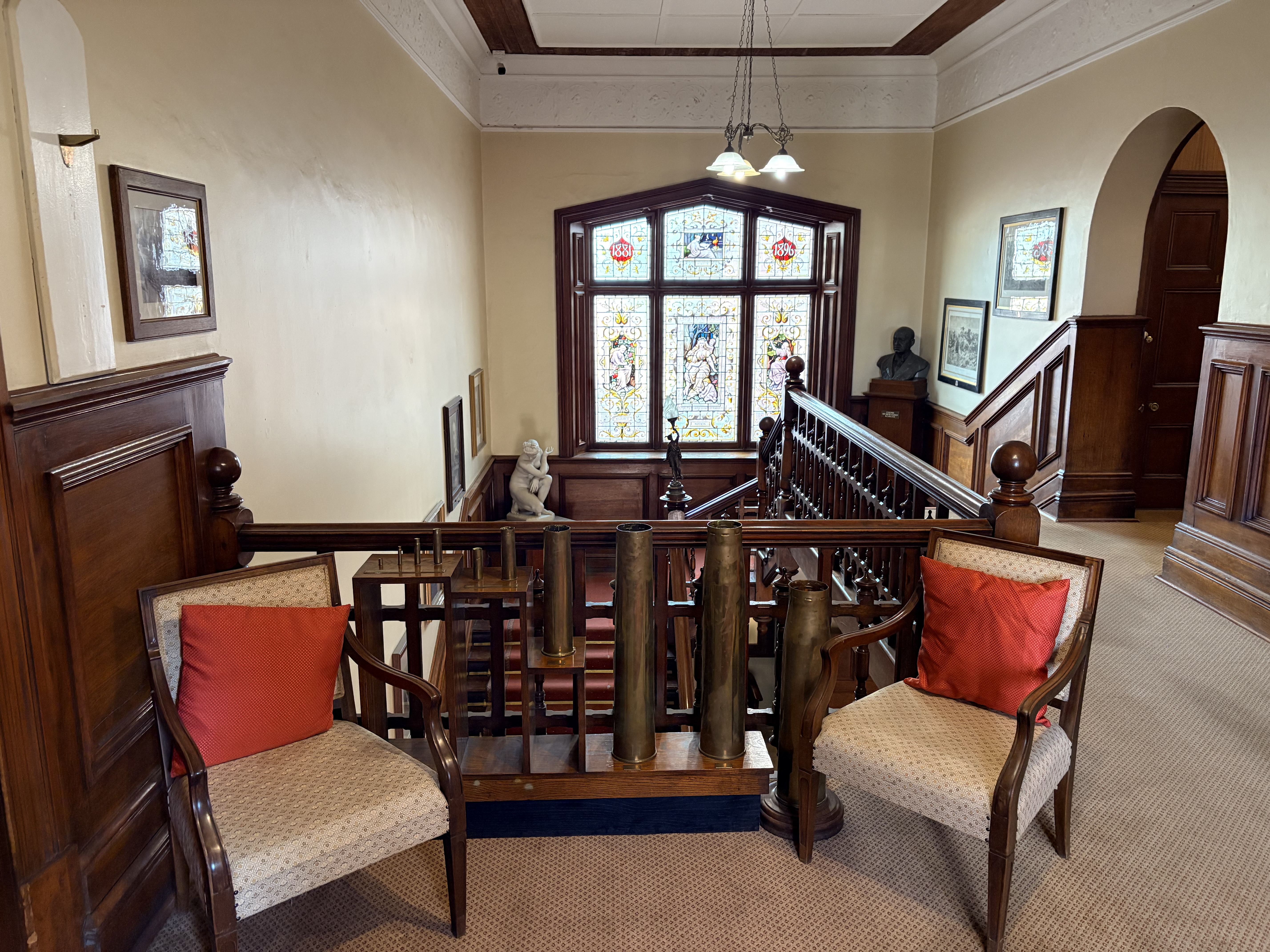 The magnificent double bend in the timber staircase, viewed from the upper floor.