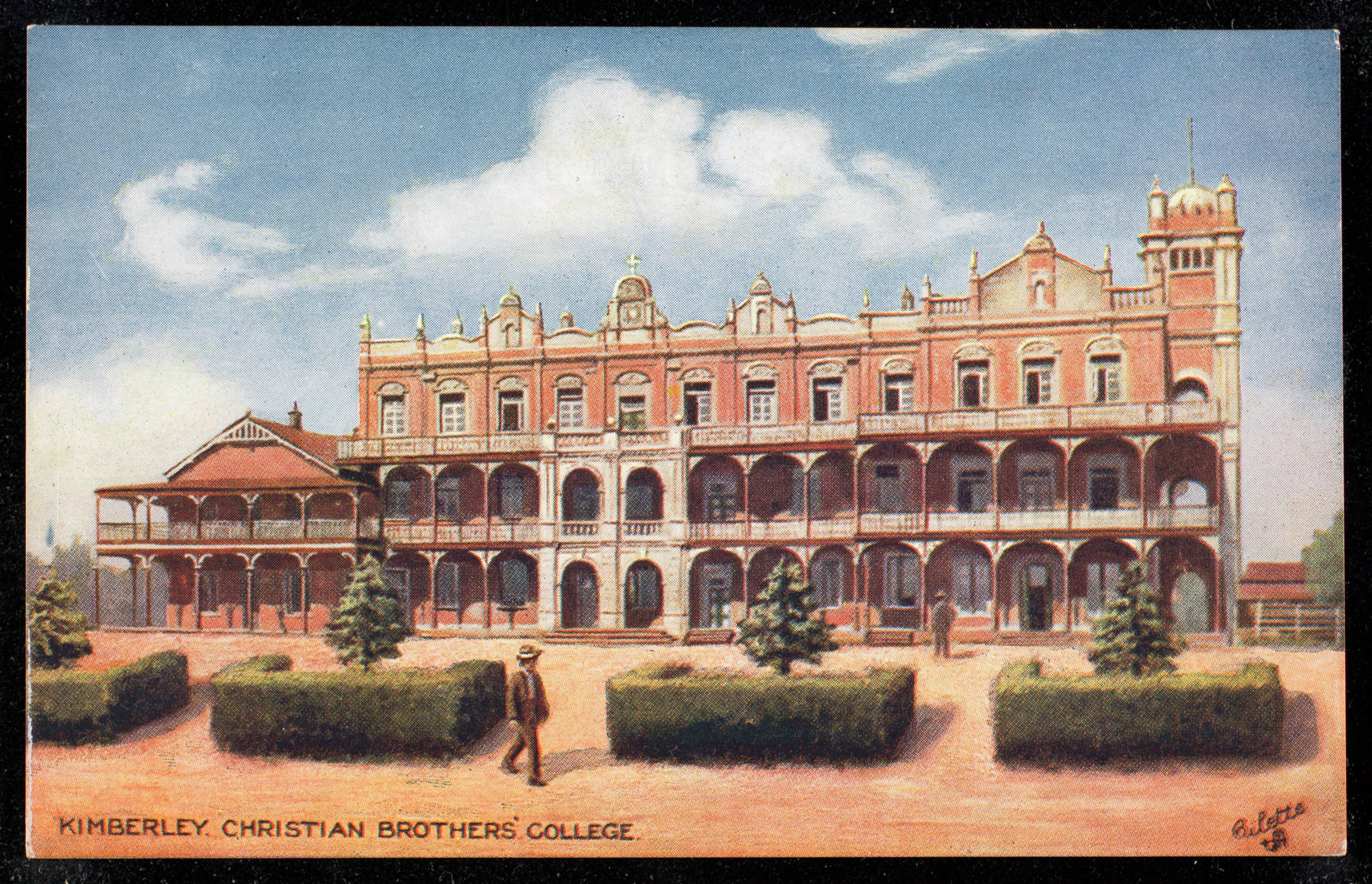Historic Oilette series postcard showing Christian Brothers’ College Kimberley with red-brick buildings, arcaded verandas, tower, formal gardens and landscaped grounds.