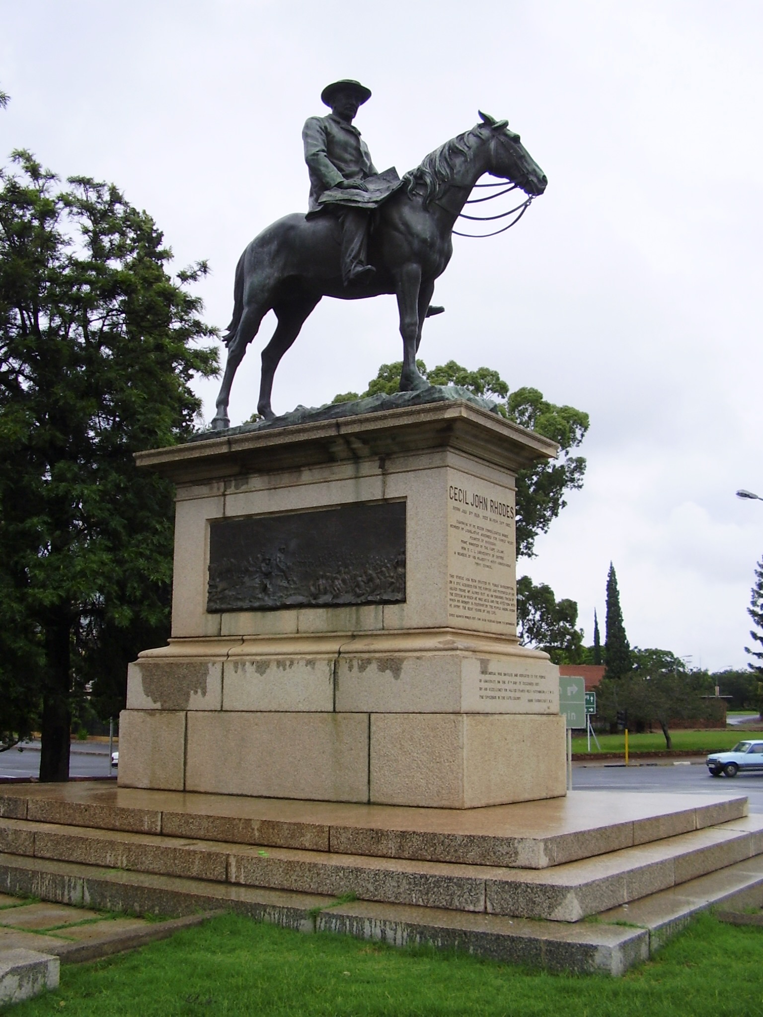 Side view of the Cecil Rhodes equestrian monument in Kimberley showing the bronze horse and rider on a large granite plinth.