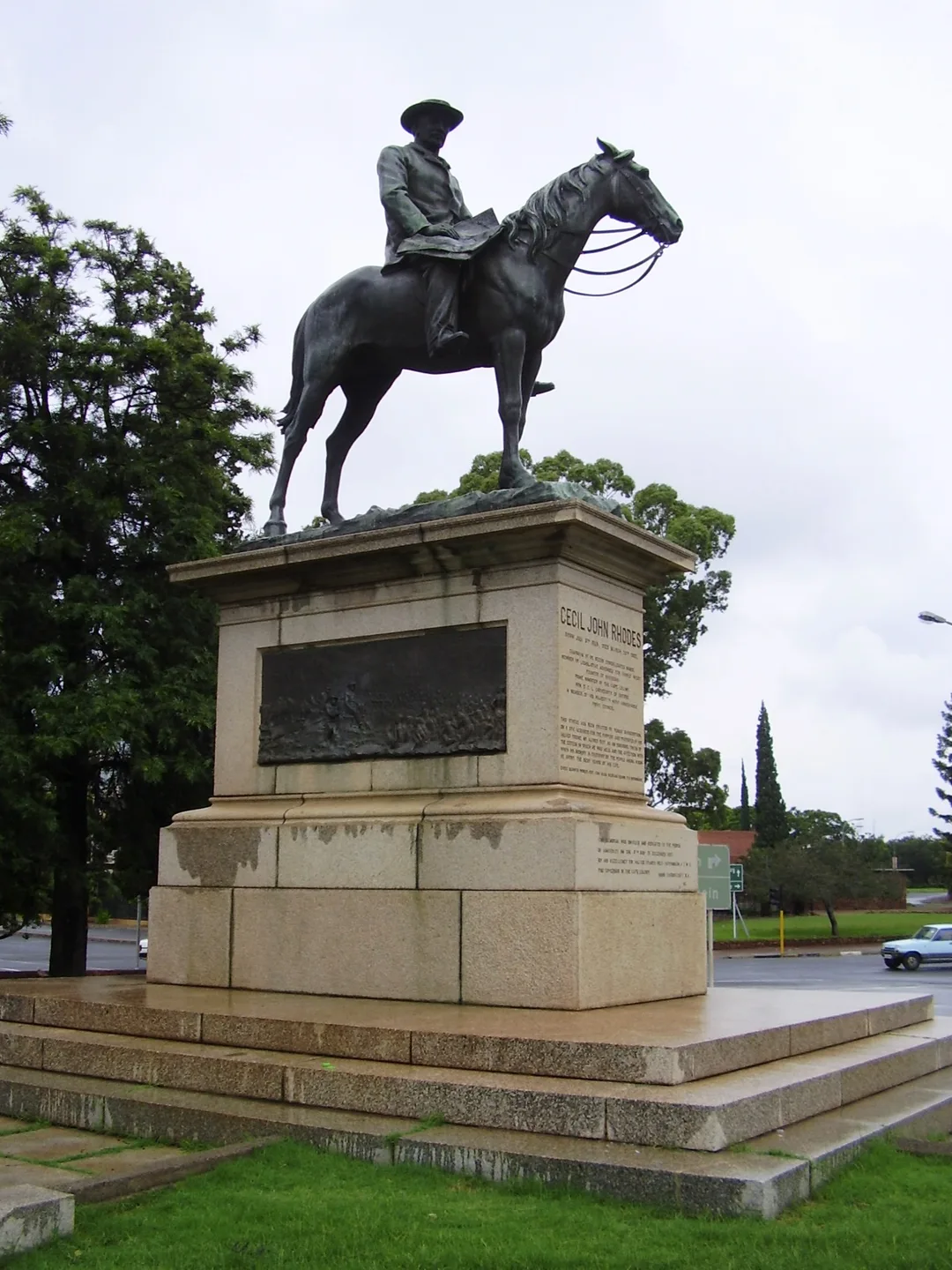 Side view of the Cecil Rhodes equestrian monument in Kimberley showing the bronze horse and rider on a large granite plinth.