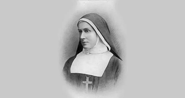 Studio portrait of Sister Henrietta Stockdale wearing the habit of the Community of St Michael and All Angels.