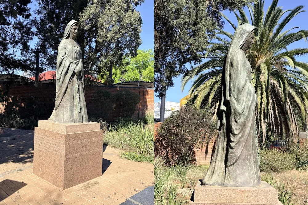 Bronze statue of Sister Henrietta Stockdale standing above her grave in the Garden of Remembrance at St Cyprian's Cathedral, Kimberley.