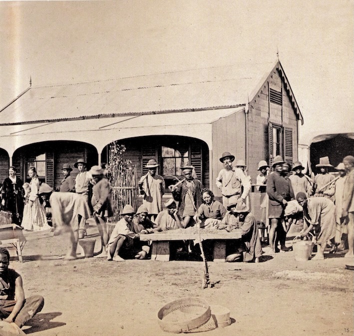 Diggers searching for diamonds outside their shacks and houses